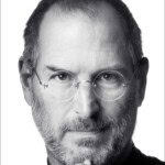 Black-and-white portrait of a man with glasses and a beard, wearing a black turtleneck, looking directly at the camera. Text above reads “Steve Jobs by Walter Isaacson.” Photo credit: Albert Watson.