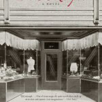 Book cover for Brooklyn by Colm Tóibín, featuring a sepia-toned image of a vintage shopfront with large display windows, and red and black text highlighting awards and reviews.